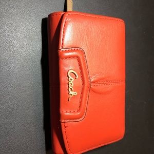 Coral colored Coach wallet